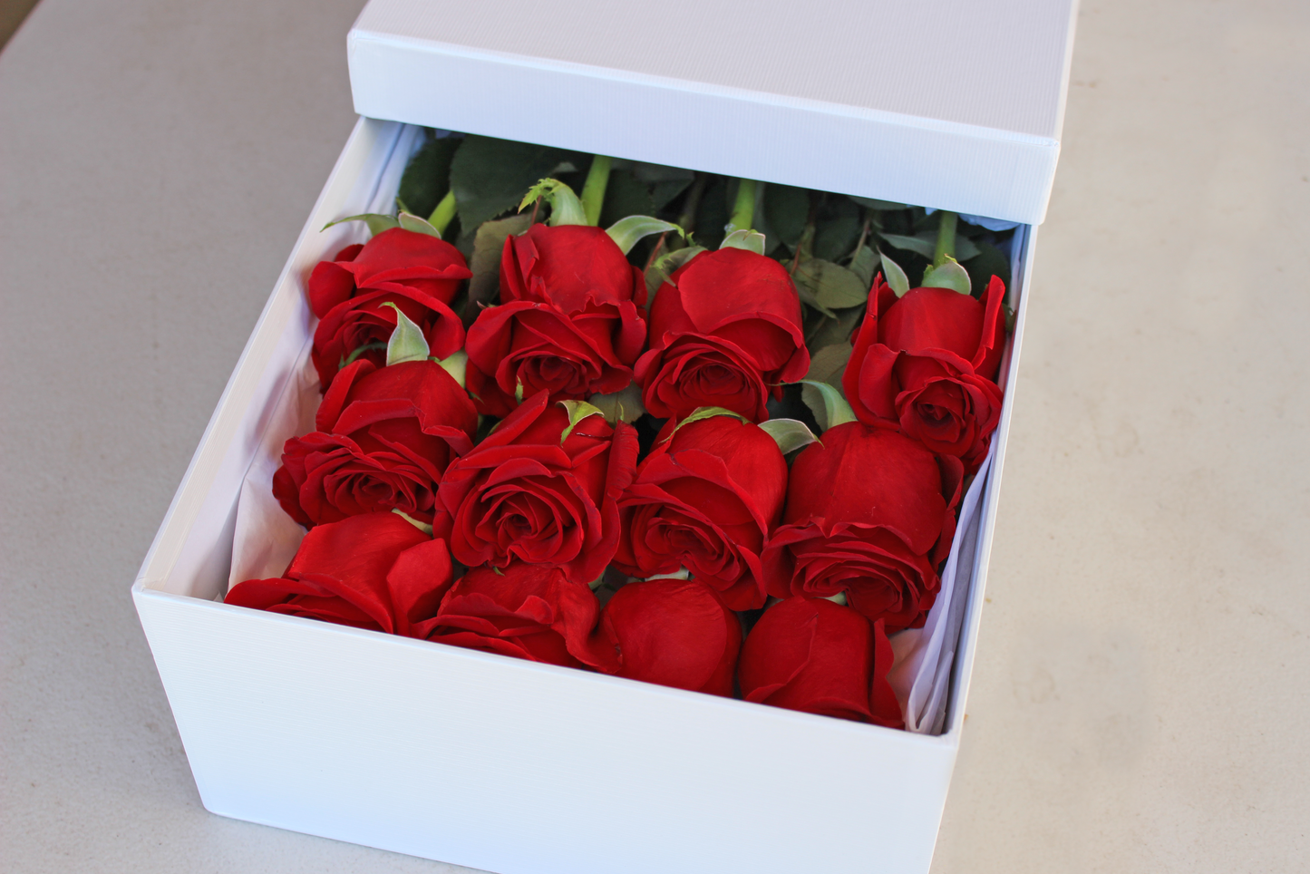 12 long stemmed Ecuador roses in a box